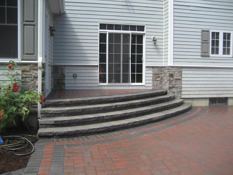 Design ideas for a large traditional backyard patio in Providence with no cover, a fire feature and brick pavers.