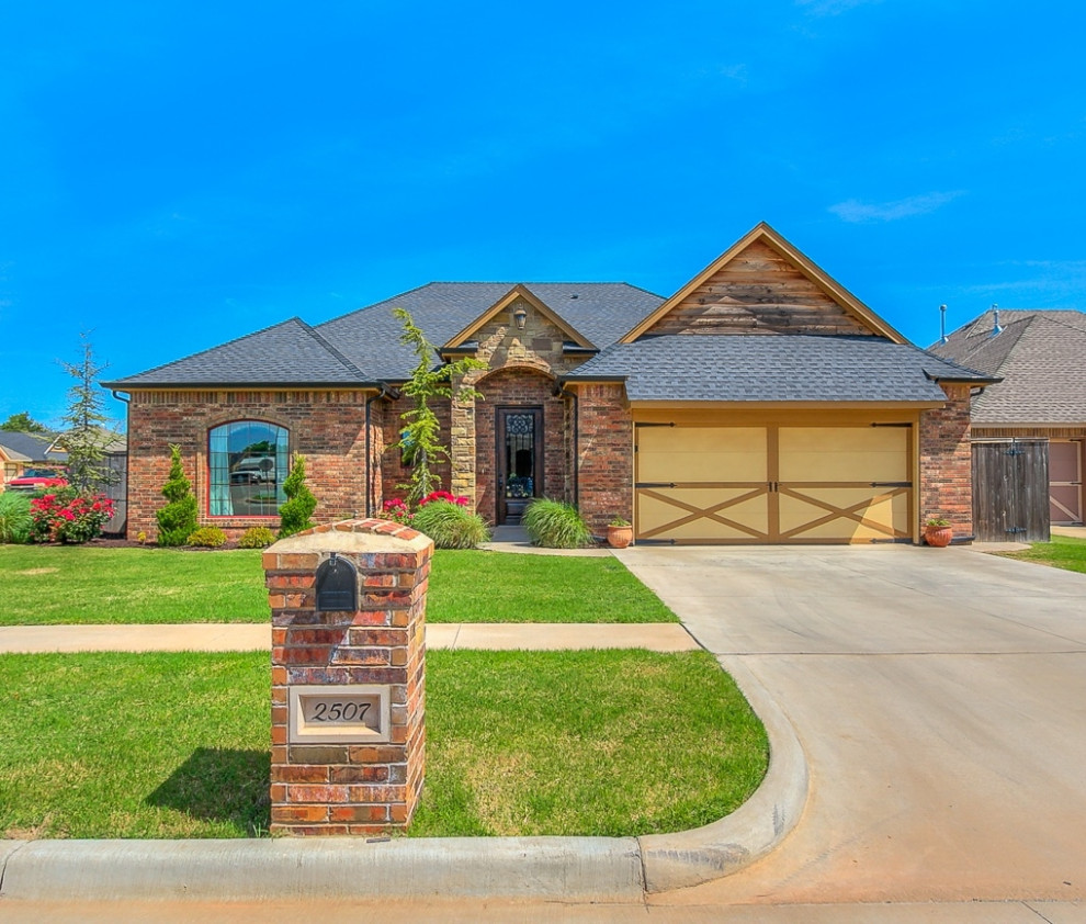 Stone, brick, and cedar double car garage