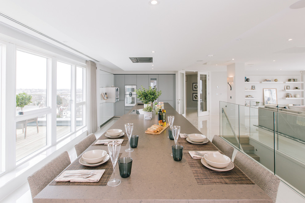 Large contemporary open plan dining in Essex with porcelain floors.