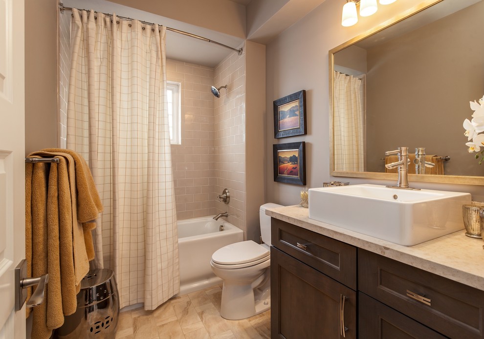 Inspiration for a mid-sized transitional master bathroom in Denver with a trough sink, shaker cabinets, grey cabinets, engineered quartz benchtops, an alcove tub, a shower/bathtub combo, a two-piece toilet, gray tile, ceramic tile, grey walls and porcelain floors.