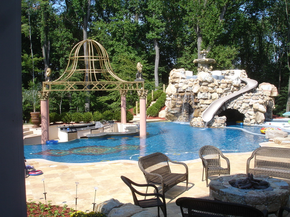 Design ideas for a large contemporary backyard custom-shaped pool in New York with a water slide and natural stone pavers.