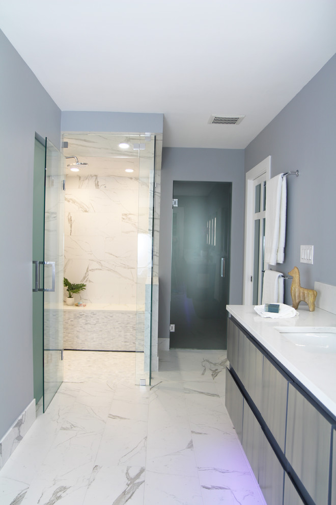 Photo of a mid-sized modern master bathroom in Atlanta with flat-panel cabinets, medium wood cabinets, a drop-in tub, a curbless shower, a bidet, black and white tile, porcelain tile, grey walls, porcelain floors, an undermount sink, engineered quartz benchtops, white floor, a hinged shower door and white benchtops.