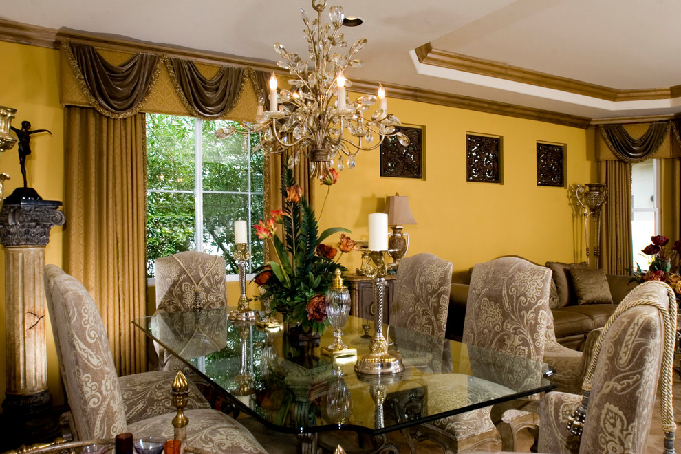 Photo of a traditional kitchen/dining combo in Orange County with yellow walls.