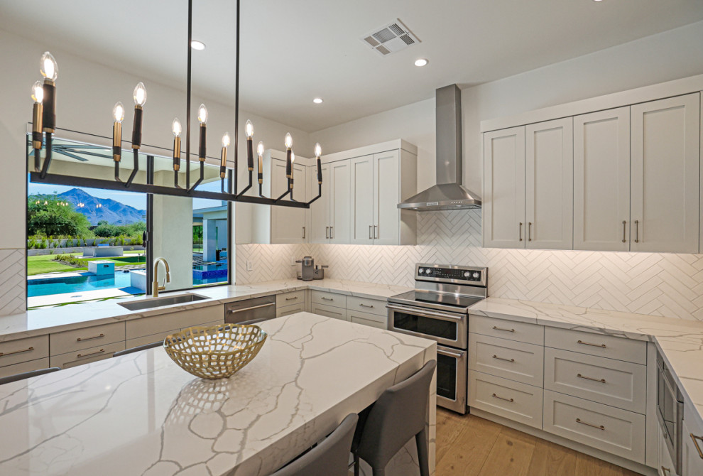 Transitional kitchen photo in Phoenix with shaker cabinets and white cabinets