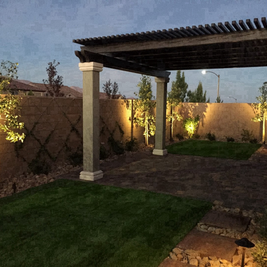 This is an example of a mid-sized traditional backyard full sun outdoor sport court in Las Vegas with concrete pavers.