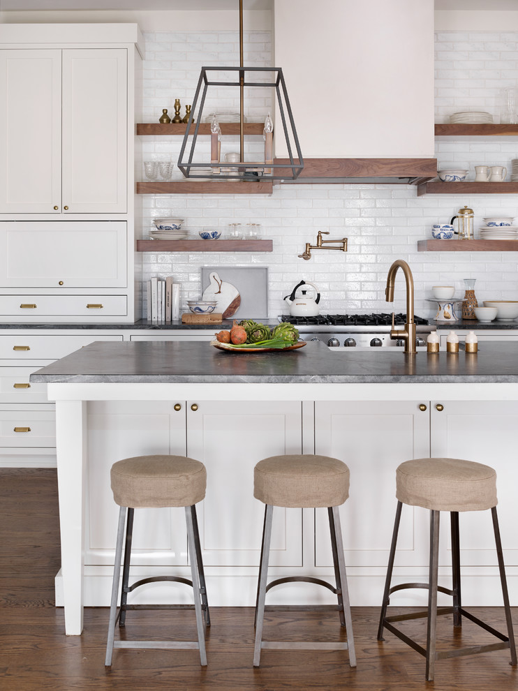 Design ideas for a transitional kitchen in Atlanta with shaker cabinets, white cabinets, white splashback, subway tile splashback, with island and dark hardwood floors.