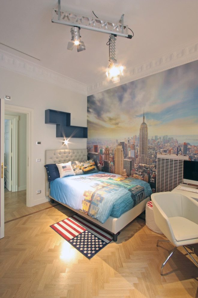 Design ideas for a large contemporary kids' room for boys in Rome with white walls and light hardwood floors.