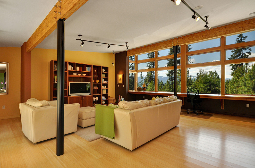 Contemporary family room in Seattle with yellow walls.