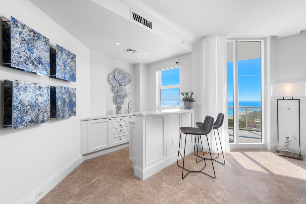Example of a transitional home design design in Miami