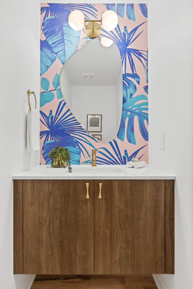This is an example of a midcentury powder room in Other.