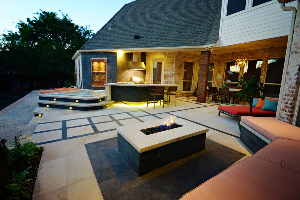 Design ideas for a mid-sized contemporary backyard patio with a fire feature, tile and no cover.