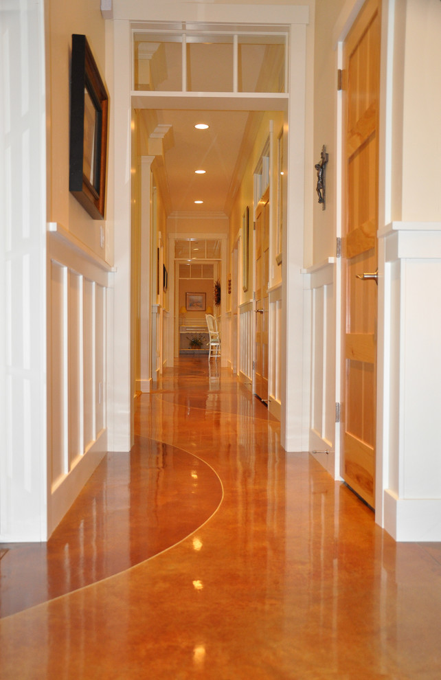This is an example of a traditional hallway in Other with orange floor.