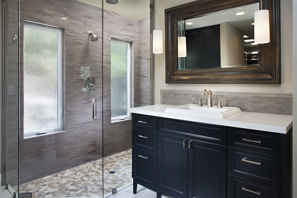 Design ideas for a contemporary bathroom in San Diego with a drop-in sink, recessed-panel cabinets, black cabinets, an alcove shower and gray tile.