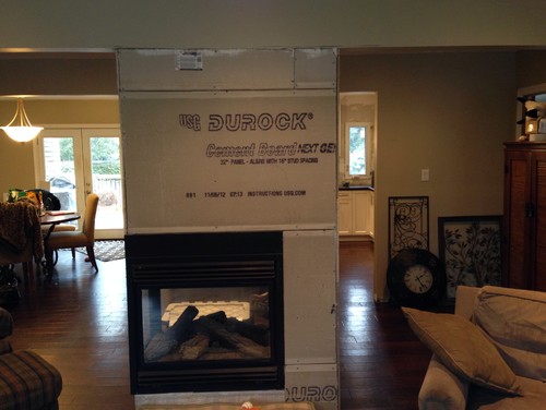 Mantel or no Mantel Hello. Need to make a decision ASAP. I have a 3 sided gas fireplace which separates kitchen from family room. Beam runs through the fireplace so stone will go up to ceiling. Ceilings are 8