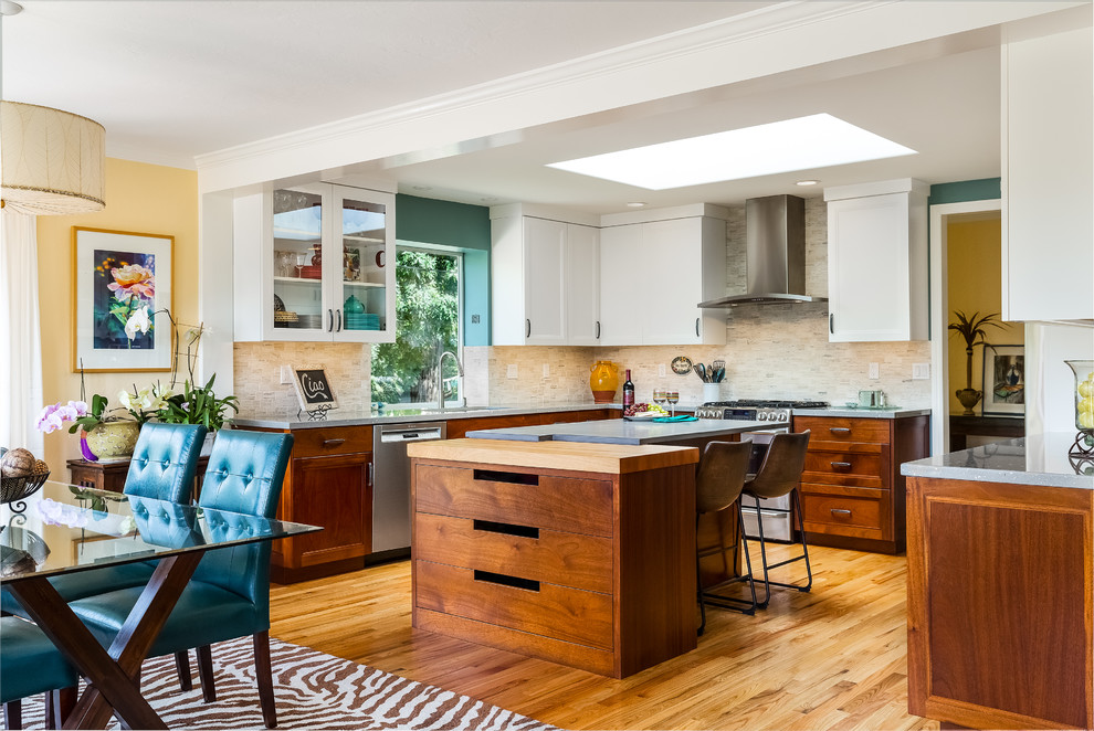 Inspiration for a mid-sized transitional medium tone wood floor kitchen remodel with a single-bowl sink, recessed-panel cabinets, concrete countertops, stone tile backsplash, stainless steel appliances, an island and gray countertops