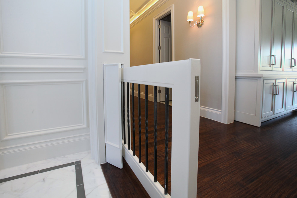 Hallway - mid-sized traditional dark wood floor hallway idea in Dallas with white walls