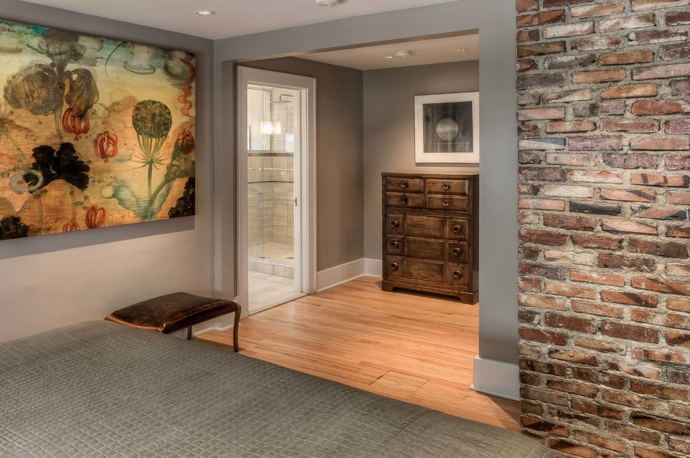 Inspiration for a large contemporary entry hall in Omaha with grey walls, light hardwood floors and beige floor.