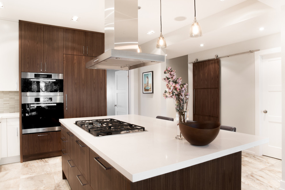 Photo of a modern kitchen in Toronto with a drop-in sink, flat-panel cabinets, white cabinets, quartz benchtops and stainless steel appliances.