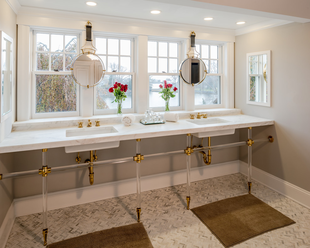 Photo of a large beach style master bathroom in New York with grey walls, marble floors, an undermount sink, marble benchtops, white floor and white benchtops.