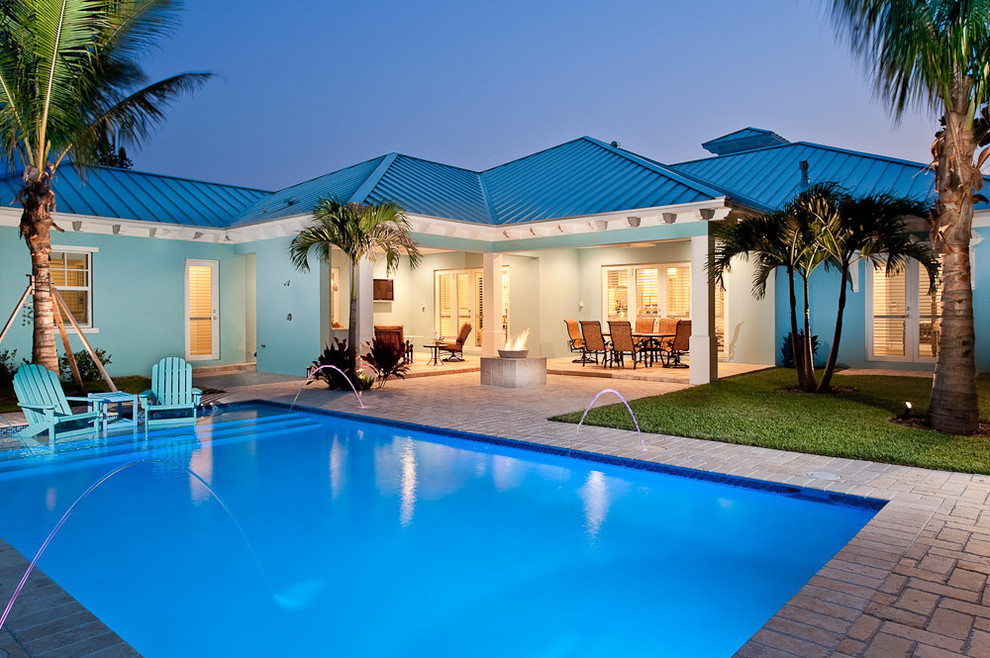 Photo of a tropical rectangular pool in Miami.