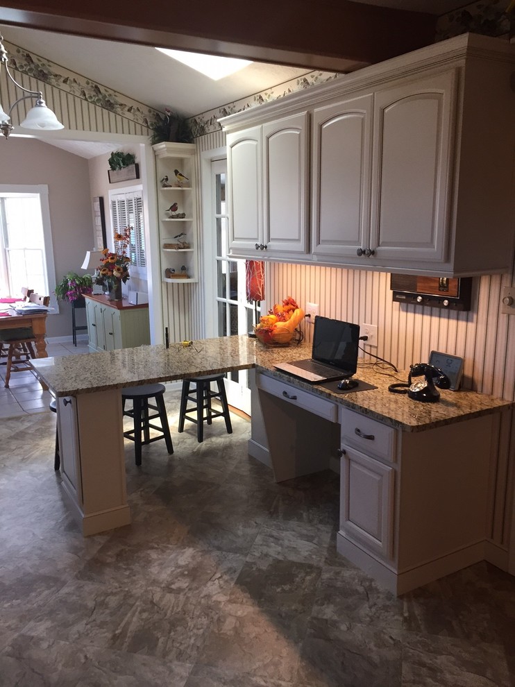Inspiration for a small transitional l-shaped eat-in kitchen remodel with raised-panel cabinets, beige cabinets, granite countertops and a peninsula