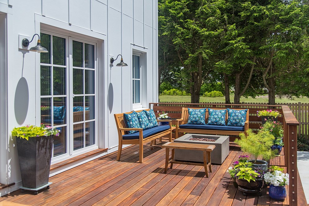 Example of a mid-sized trendy backyard deck container garden design in Boston with no cover