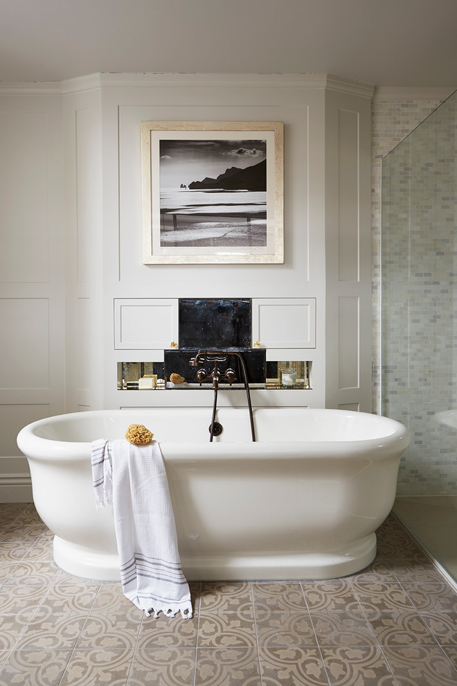 Inspiration for a transitional master bathroom in London with shaker cabinets, white cabinets, a freestanding tub, an alcove shower, beige tile, brown tile and beige walls.