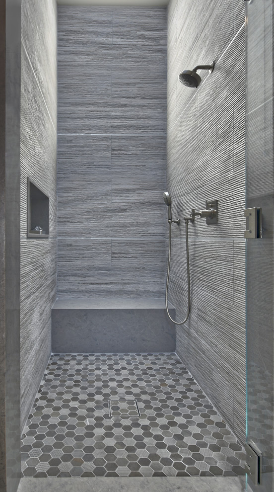Mid-sized contemporary powder room in Los Angeles with flat-panel cabinets, grey cabinets, a one-piece toilet, white tile, porcelain tile, white walls, ceramic floors, a vessel sink, engineered quartz benchtops and black floor.