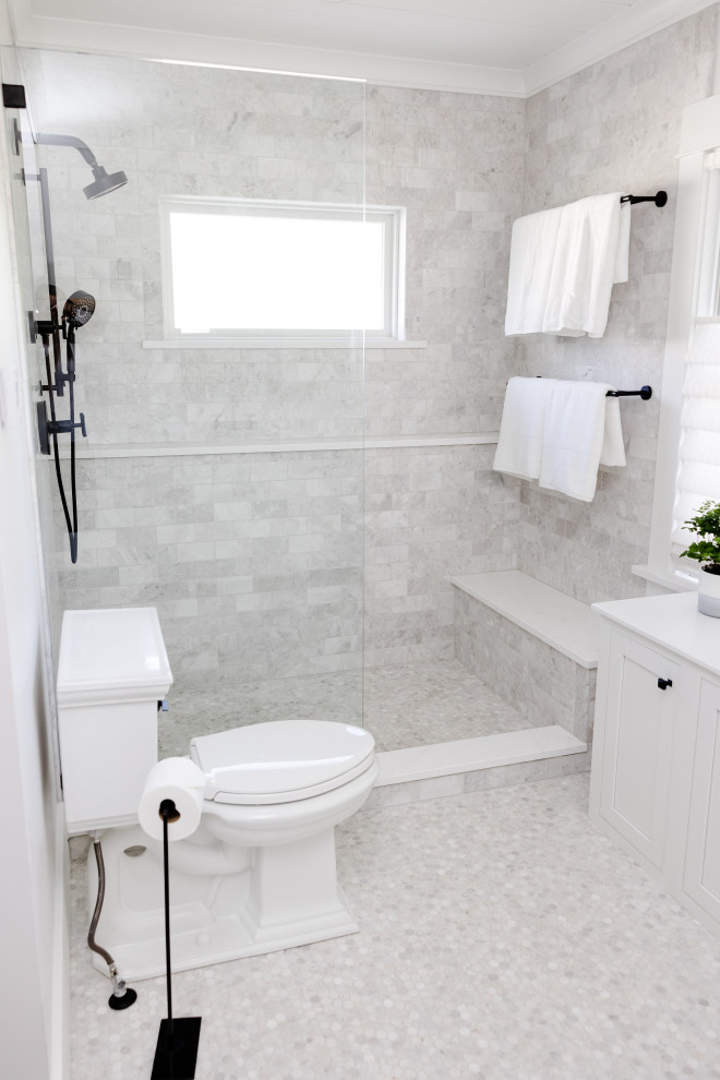 Design ideas for a large arts and crafts master bathroom in New York with beaded inset cabinets, white cabinets, an open shower, a two-piece toilet, white tile, marble, white walls, marble floors, an undermount sink, engineered quartz benchtops, white floor, white benchtops, a shower seat, a single vanity, a built-in vanity and timber.