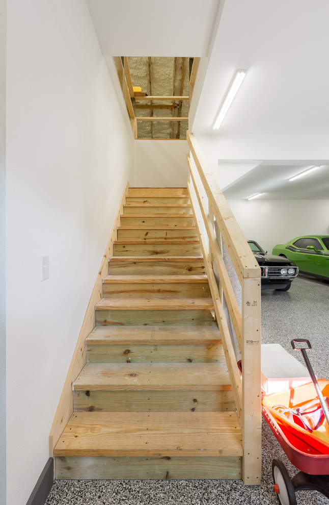 Staircase - huge transitional detached three-car staircase idea