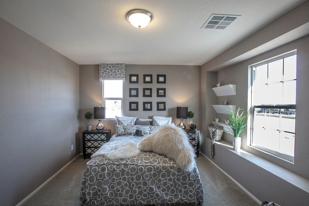 This is an example of a mid-sized contemporary guest bedroom in Las Vegas with grey walls and carpet.