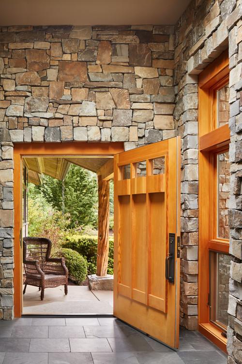 Stone walls and accents anchor this Redmond home design.
