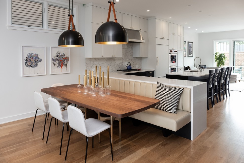 Inspiration for a mid-sized contemporary open plan dining in Chicago with white walls, light hardwood floors and beige floor.