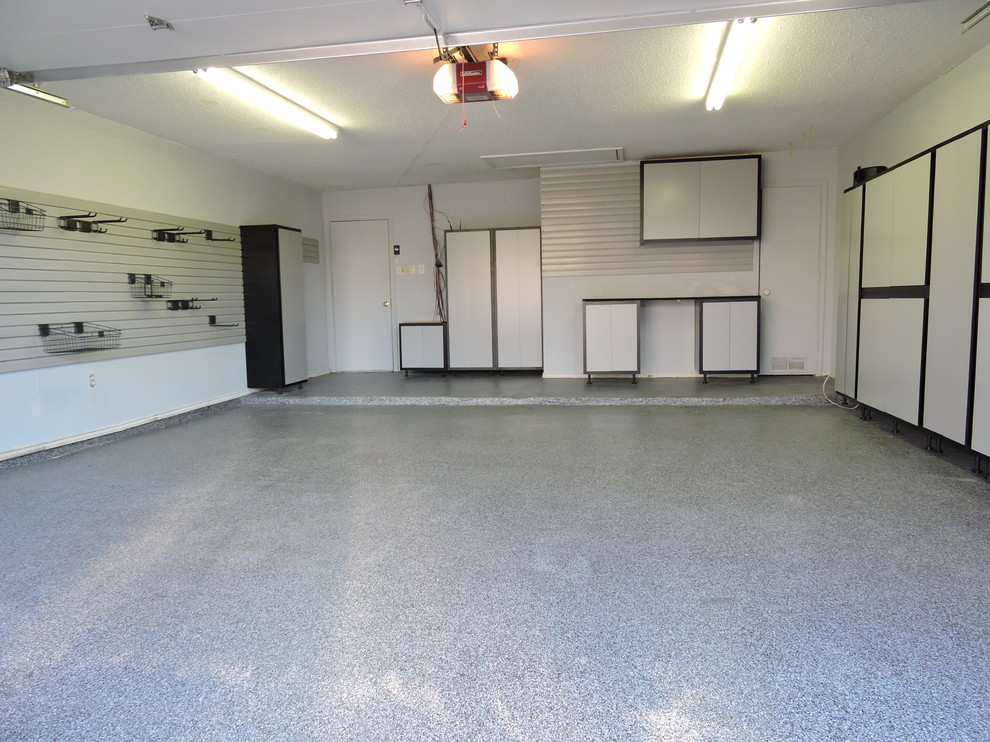 Inspiration for a mid-sized transitional attached two-car garage workshop remodel in Dallas