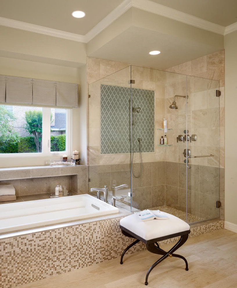 Inspiration for a mid-sized transitional master bathroom in Austin with raised-panel cabinets, dark wood cabinets, a drop-in tub, a corner shower, beige tile, travertine, ceramic floors, an undermount sink, limestone benchtops, beige floor, a hinged shower door, green benchtops, a double vanity and a built-in vanity.