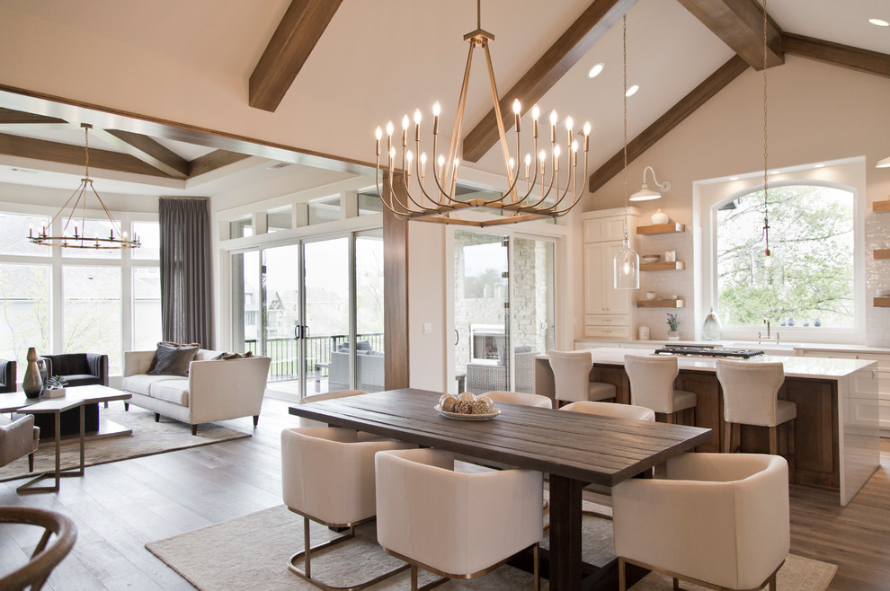 Large modern open plan dining in Kansas City with beige walls, medium hardwood floors and brown floor.