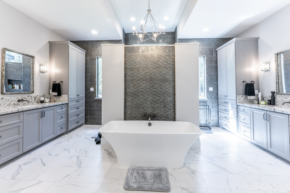 Inspiration for a contemporary black and white tile and porcelain tile laminate floor and single-sink bathroom remodel in Houston with blue cabinets, a one-piece toilet, an undermount sink, quartzite countertops and a built-in vanity
