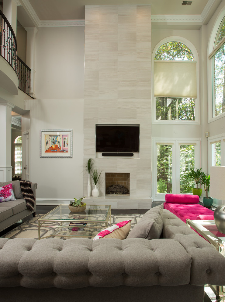 Photo of a contemporary formal open concept living room in DC Metro with beige walls, a standard fireplace, a brick fireplace surround and a built-in media wall.