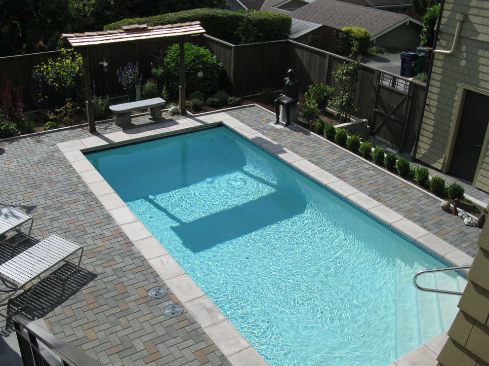 Design ideas for a mid-sized asian backyard rectangular lap pool in Seattle with brick pavers.