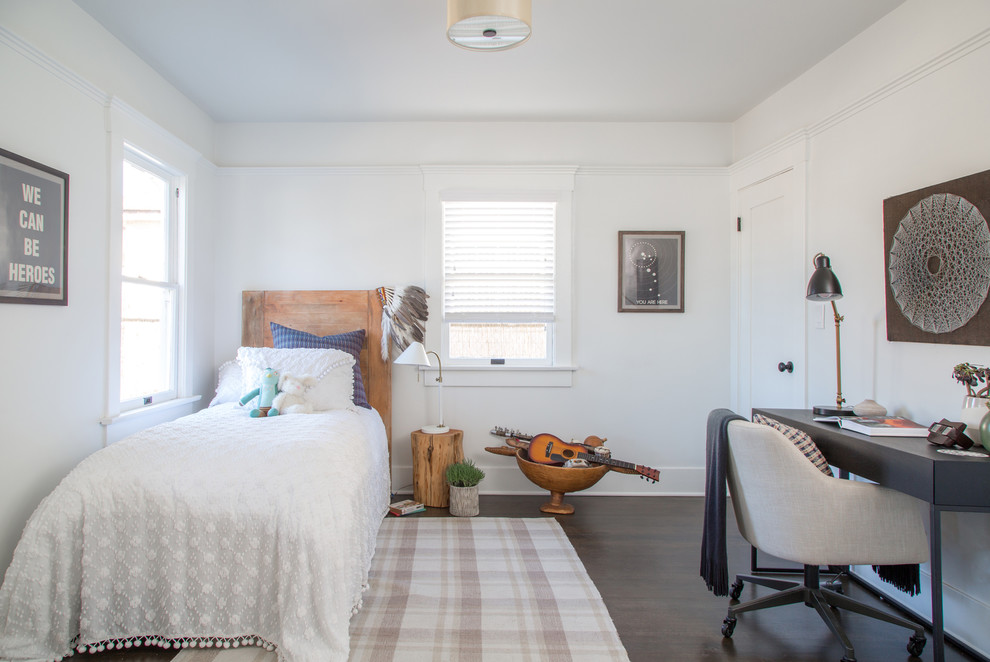 This is an example of a transitional kids' room in Los Angeles with white walls, dark hardwood floors and brown floor.