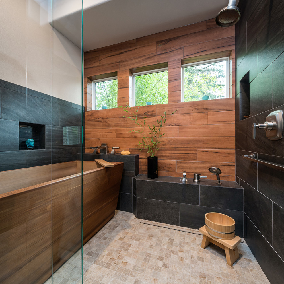 Inspiration for a transitional bathroom in Portland with a freestanding tub, an alcove shower, black tile, brown tile, porcelain tile, beige walls, porcelain floors, beige floor and a hinged shower door.