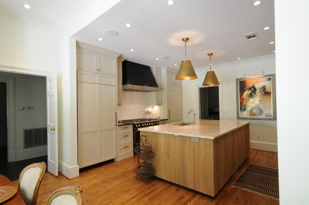 Open concept kitchen - large transitional u-shaped dark wood floor and brown floor open concept kitchen idea in Birmingham with an undermount sink, shaker cabinets, white cabinets, granite countertops, white backsplash, mosaic tile backsplash, paneled appliances and an island