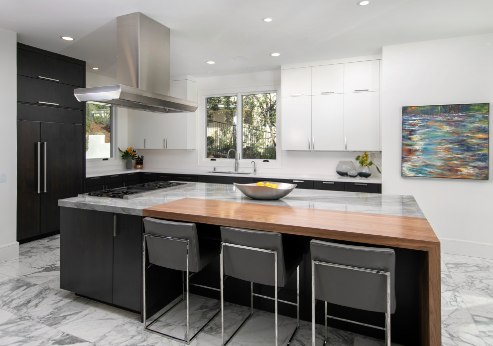 Inspiration for a mid-sized contemporary u-shaped marble floor and white floor open concept kitchen remodel in San Luis Obispo with an undermount sink, flat-panel cabinets, dark wood cabinets, granite countertops, white backsplash, stainless steel appliances, an island and gray countertops