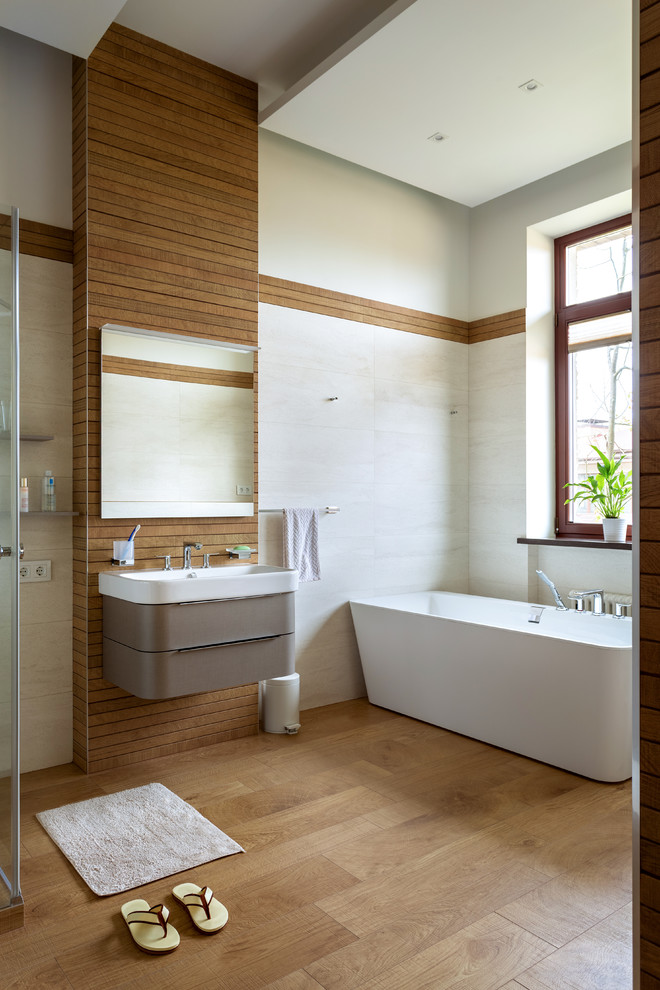 This is an example of a mid-sized master bathroom in Moscow with raised-panel cabinets, white walls, brown floor, a freestanding tub, a shower/bathtub combo, matchstick tile, terra-cotta floors, a console sink, a hinged shower door, a single vanity and recessed.