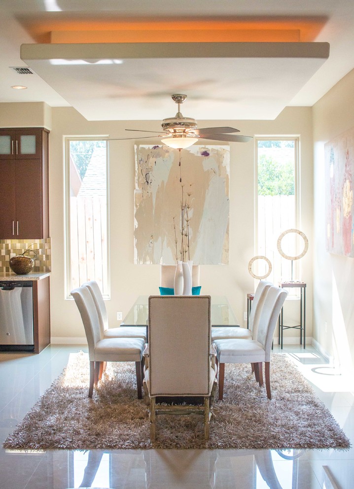 Inspiration for a mid-sized transitional porcelain tile and white floor kitchen/dining room combo remodel with beige walls and no fireplace