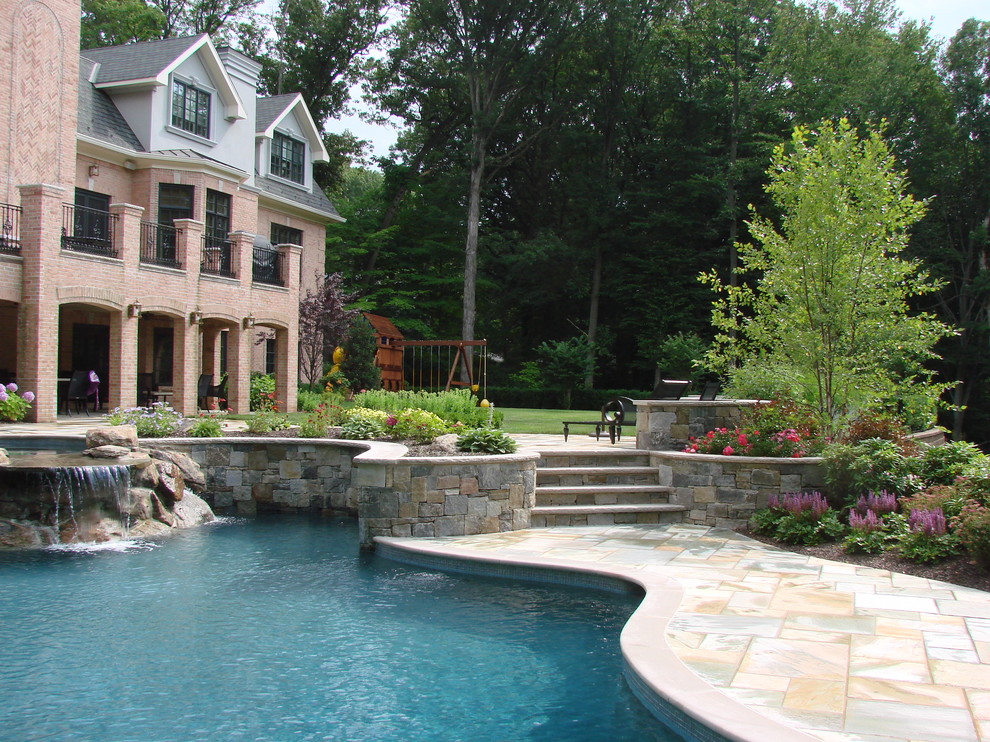 Photo of a traditional custom-shaped pool in New York.