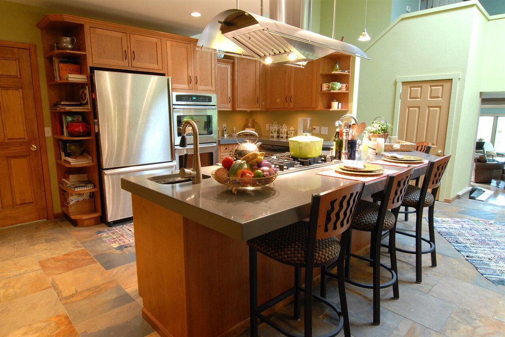Photo of a large transitional l-shaped open plan kitchen in Other with an undermount sink, shaker cabinets, medium wood cabinets, quartz benchtops, stainless steel appliances, slate floors, with island, multi-coloured floor and grey benchtop.