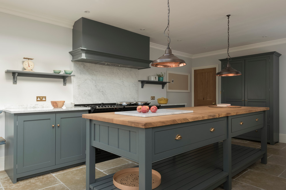 This is an example of a contemporary eat-in kitchen in Other with shaker cabinets, grey cabinets, limestone floors and with island.