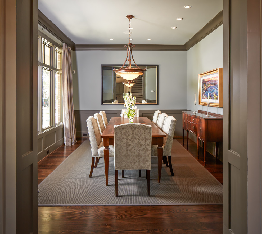 Mid-sized traditional separate dining room in Houston with white walls and dark hardwood floors.