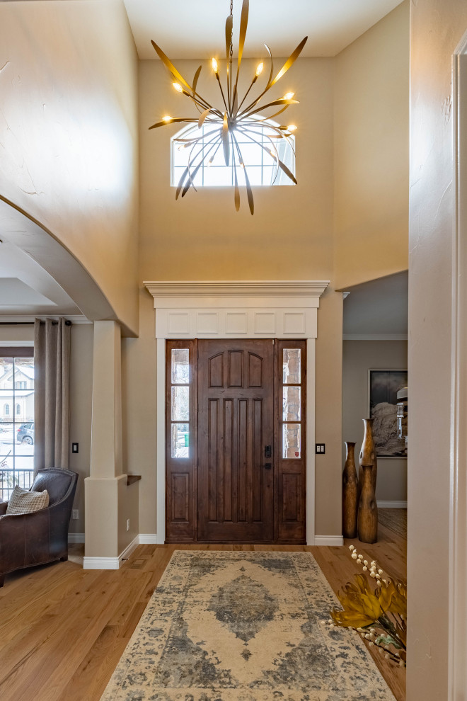Inspiration for a medium sized midcentury front door in Denver with beige walls, light hardwood flooring, a single front door and a dark wood front door.